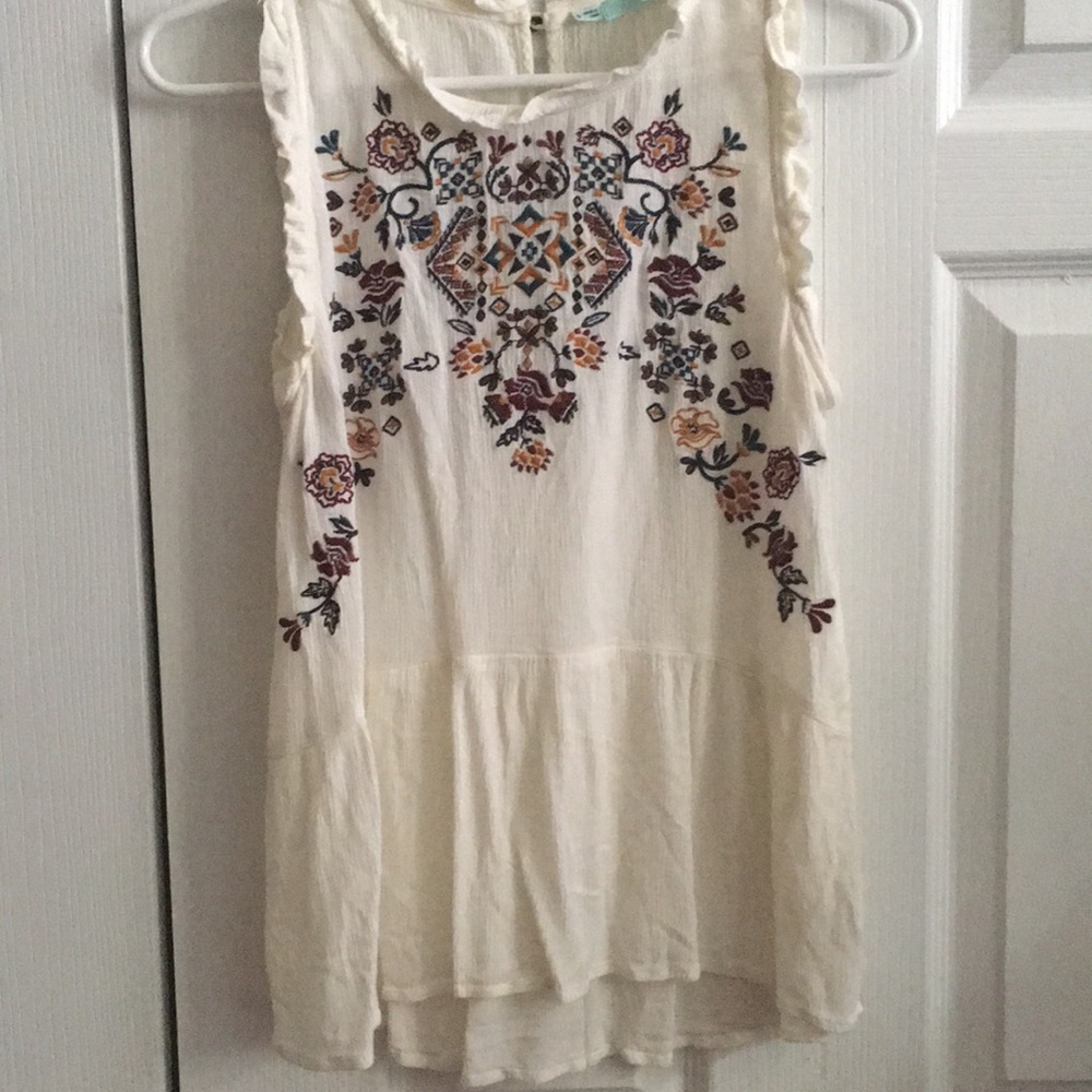 Embroidered sleeveless peplum top